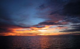 Sunset over the sea Обои