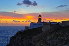 Lighthouse at sunset Обои